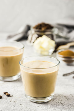 Cinnamon bulletproof coffee in glasses. Selective focus, space for text.