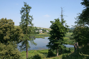 View of the lake and the village. Castle wall and landscape.