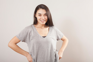 Obraz premium Young beautiful portrait woman on gray background
