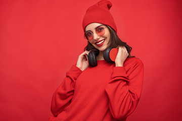 Content girl in red outfit and sunglasses 