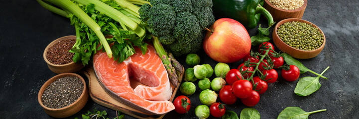 Flat lay of healthy food. Selection of healthy eating fish, vegetables, beans, antioxidants and sources of omega 3. Healthy food for heart, diet and healthy lifestyle concept. Top view