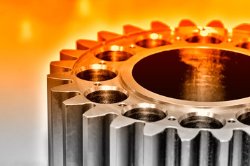 Industrial gear on light background. Red toned