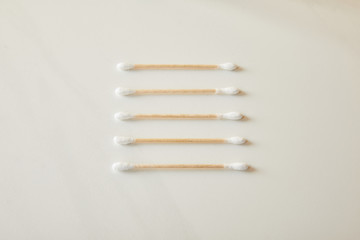 ear sticks on white marble background