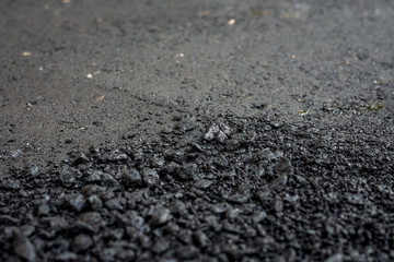 Laying of new asphalt. The new road. Road repair street.