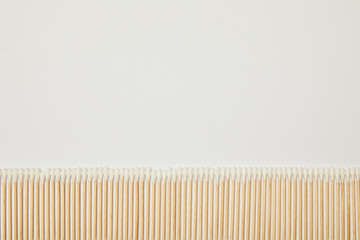 top view of ear sticks laid out on white background