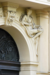 Decoration of the entrance to the building with architectural elements depicting the figures of...