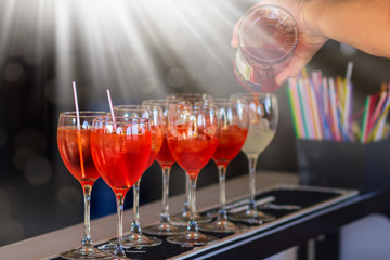 Aperol spritz cocktail in glass on bar table