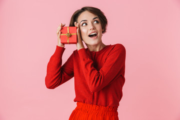 Portrait of a beautiful young woman wearing red clothes