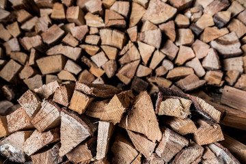 Birch firewood. Broken ax birch logs are in disarray
