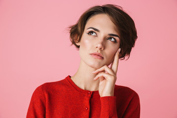 Portrait of a beautiful young woman wearing red clothes