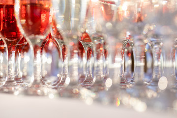 Blured background from wedding glasses filled with champagne