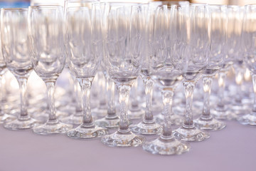 Blured background from wedding glasses filled with champagne