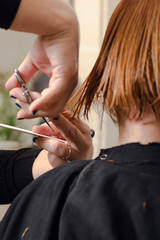 Obraz na płótnie Canvas Hairdresser prepair hair for cutting