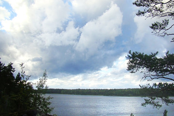 Beautiful landscape with sky and clouds over the lake.