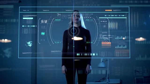 future, technology and people concept - woman working with virtual computer touch screen in dark room