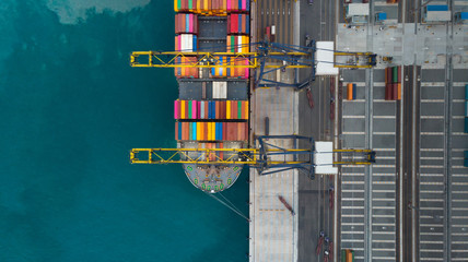 Aerial of cargo ship carrying container and running for export  goods  from  cargo yard port to...