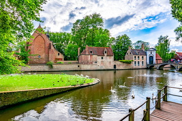 Fototapeta na wymiar Swans at Lake of Love and Beguinage, Bruges, Belgium