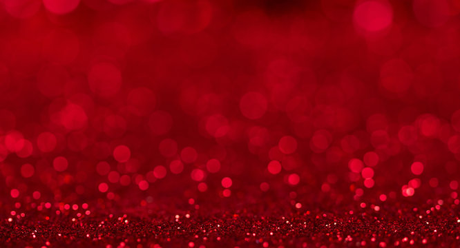 Bright beautiful sparkling red background with bokeh effect