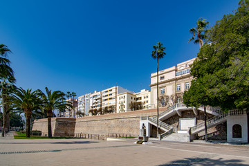 View to empty palm lined promenade of ancient fortification of Cartagena, Spain