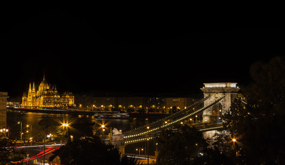 View of the illuminated chain bridge and the Hungarian Parliament in Budapest
