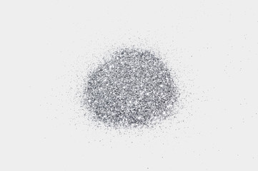 Silver glitter sparkle on light gray background 