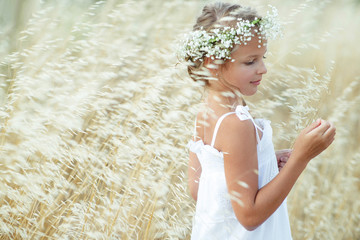 Girl with a wreath of flowers