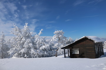 Winter wonderland with mountain chalets in the Serbia