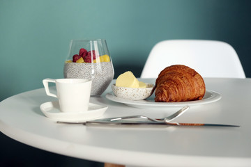 Breakfast on the table, croissants and fruit smoothies