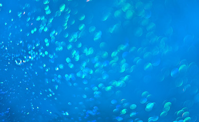 The unfocused background  of shining drops of water  on the turquoise  for text, banner, poster, label, sticker, layout.