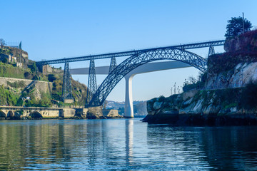 Fototapeta na wymiar Maria Pia Bridge and the Sao Joao bridge, in Porto