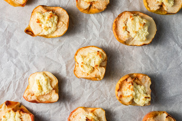 baked apples with curd on white paper. copy space