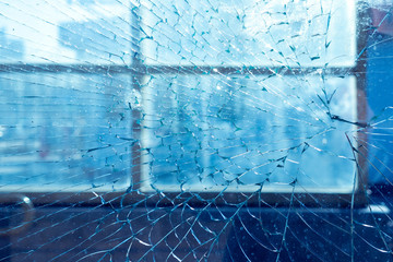broken window in frame. on the background of the city and street. texture