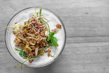 Vitamin breakfast of yogurt and bean , sunflower and flax seeds sprouts