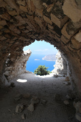 View of the coast from a stone cave in the ruins of Monolitos Castle, Rhodes Island, Greece