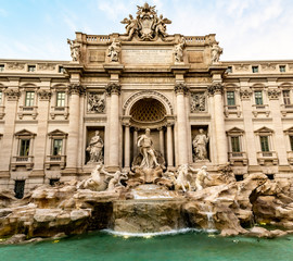 Fototapeta na wymiar The famous Trevi Fountain, the largest Baroque Fountain in Rome, located in the Trevi district, designed by Italian architect Nicola Salvi and completed by Guiseppe Pannini and several others.
