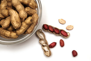 peanuts in a bowl isolated on white