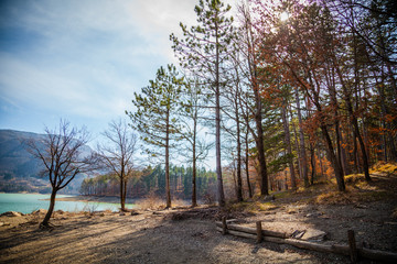 Mountain lake between by mountains, sunny day 