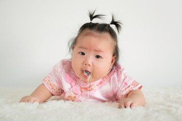 Baby girl Infant four months vomiting milk.