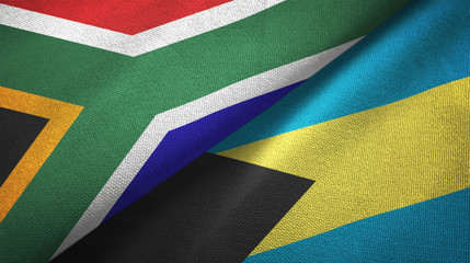 Fototapeta premium South Africa and Bahamas two flags textile cloth, fabric texture