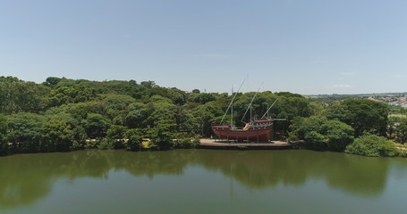 Drone image of the Portugal Park of Campinas SP Brazil, Sailboat and fountain on the lake	