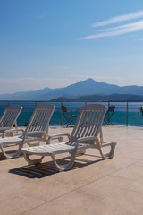 pool chairs overlooking ocean