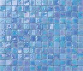Bright iridescent blue mosaic tiles texture background.