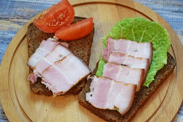 Smoked bacon, sliced on a wooden Board. Smoked bacon.