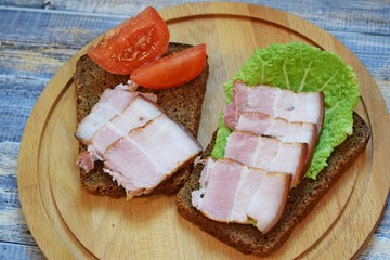 Smoked bacon, sliced on a wooden Board. Smoked bacon.
