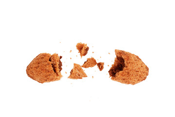 Chocolate Corn Crunch is broken into pieces on a white background