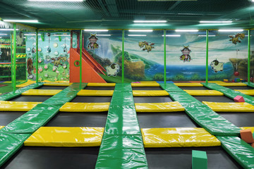 Interconnected trampolines for indoor jumping. New revolution playground and fun activity for all...