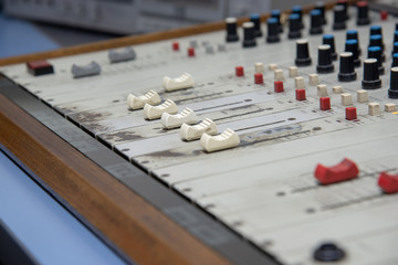 Antique radio mixer with faders, mixers, equalizers, pan-balance and the air button