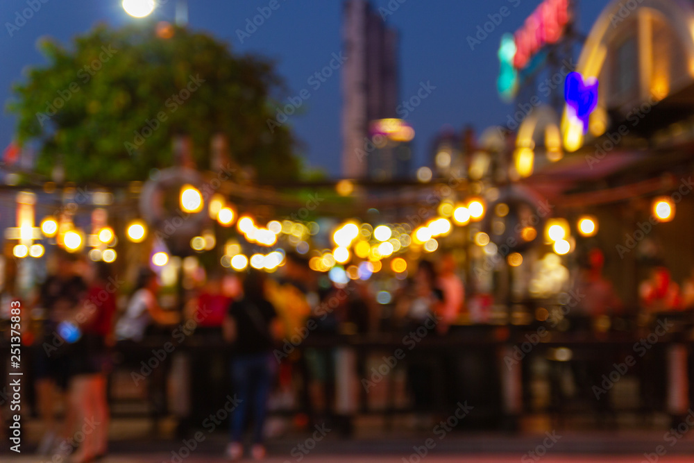 Poster abstract blur image of night festival in a restaurant and the atmosphere is happy and relaxing with 