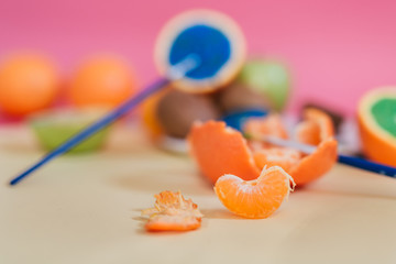 Different kinds of fruit photographed on colorful background and painted with different colours.