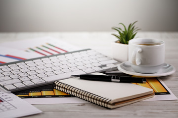 Items for business on a light background on the table, view from the top